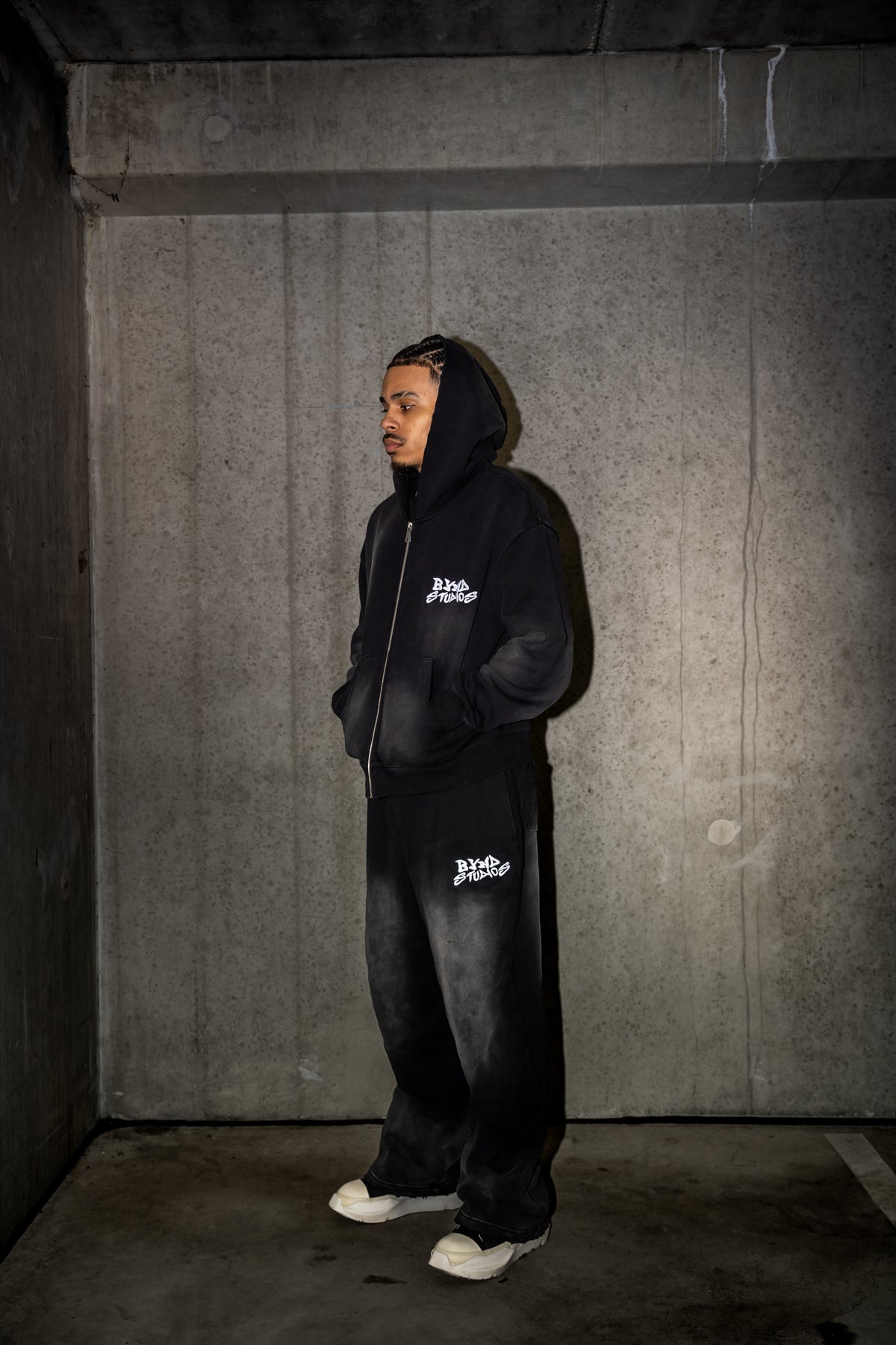 Model wearing the BYND STUDIOS Black Set with the hood up