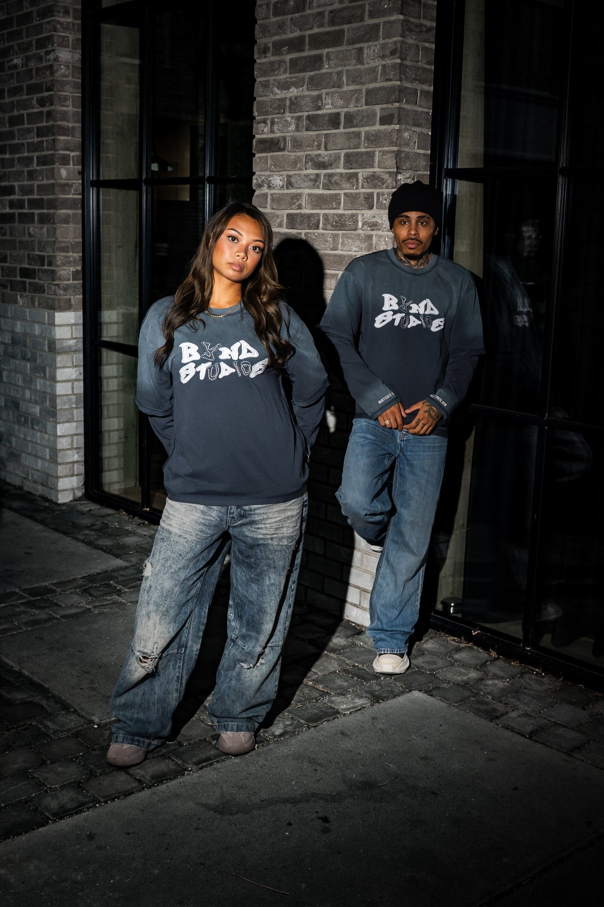 Two models wearing BYND STUDIOS double layered longsleeves on the street